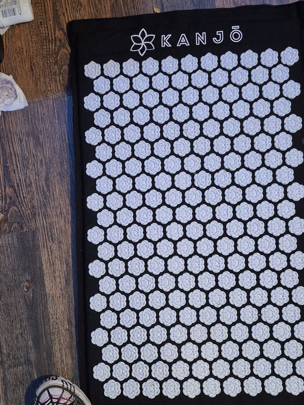 Black Acupressure Massage Mat with White Flower Nodes